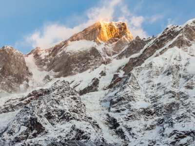 Snow-covered Himalayan mountains near Kedarnath glowing in the morning sunlight