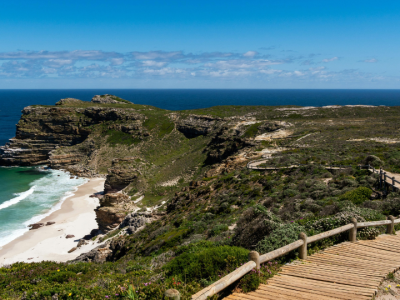 Cape of Good Hope coastline with scenic cliffs, wooden boardwalk, and the Atlantic Ocean.