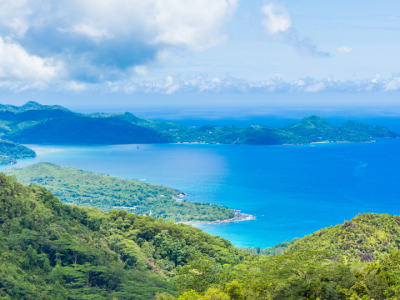 Enjoy breathtaking panoramic views of Seychelles, where lush tropical mountains, emerald forests, and the turquoise Indian Ocean create an unforgettable island paradise.