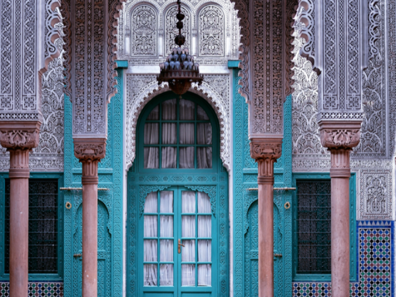 Marvel at the intricate Islamic artistry of Morocco's historic palaces, featuring beautifully carved arches, colorful zellige tiles, and elegant courtyards.